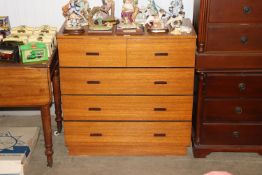 A teak G-plan style chest fitted two short over three long drawers