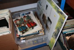 A box containing various pictures and prints, old
