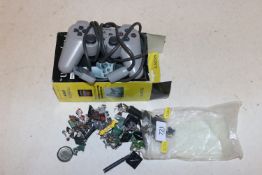 A collection of Warhammer figures and a Playstatio