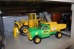 A Tonka truck and a Goodyear digger