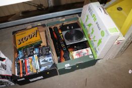 Two boxes containing various video games, Guitar H