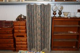 A four fold upholstered screen.