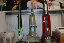 A Dyson DC01 upright vacuum cleaner