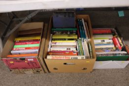 Three boxes containing various modern hardback boo