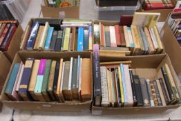 Four boxes containing various poetry works, includ