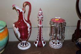 A Victorian Bohemian overlaid glass ewer and simil