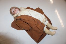 An antique German porcelain doll