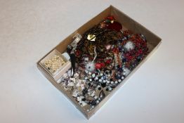 A box of various costume jewellery to include bead