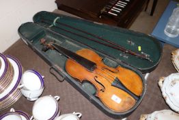 A violin in wooden carry case with two bows AF