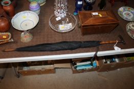 A silver handled antique umbrella