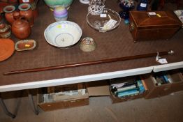 A silver capped walking cane