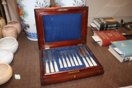 A mahogany canteen and contents of mother of pearl