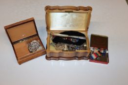 Two jewellery boxes and a tin containing various c