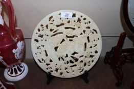 A circular hardstone Chinese dish carved with stor
