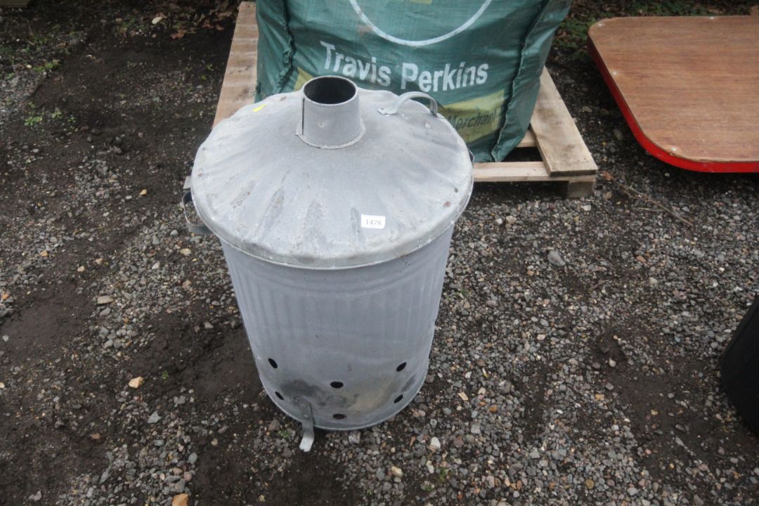 A galvanised garden burner