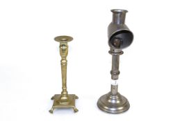 A students nickel plated candle lamp and a brass candle holder