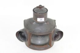 An unusual copper hanging or fixed paraffin operated lamp with red and green glass indicators to the