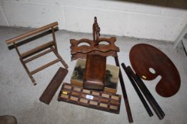A 19th Century oak wine bottle holder, wooden map rollers, a mahogany artists pallet etc.