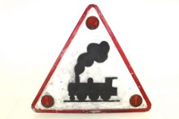 A triangular metal painted railway / train warning sign with reflectors, approx. 32