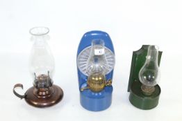 Three various paraffin lamps with chimneys