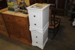 A pair of modern bedside chests fitted two drawers