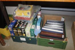 Two boxes containing various jigsaws to include Wa
