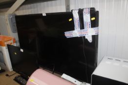 A LG flat screen television and remote control