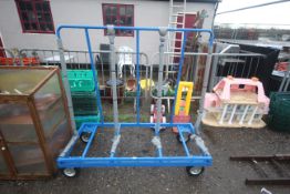 A metal warehouse upright trolley on four caster w
