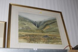 A gilt framed watercolour study of a landscape scene, indistinctly signed