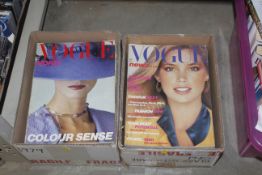 Two boxes containing Vogue magazines to include 19