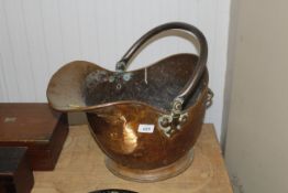 A copper coal scuttle