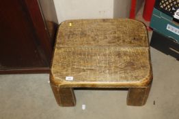 A hardwood coffee table of small proportions