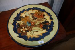 A long park floral decorated terracotta charger
