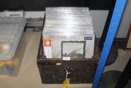 A box containing various LP's