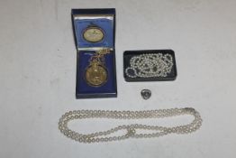 A 22ct gold plated Royal Mint coin in mount hung to chain, together with 925 sterling silver