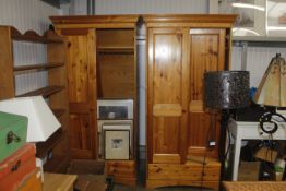 A pair of pine two door wardrobes