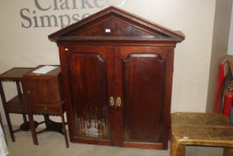 The upper section of an antique mahogany unit, fit