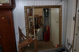 A large gilt frame bevel edged wall mirror