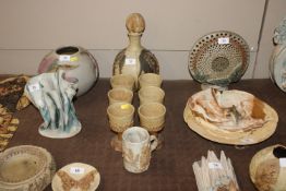 A Bernard Rooke pottery decanter and six matching