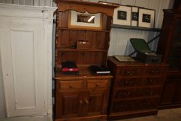 A modern pine dresser fitted two drawers raised on