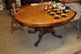 A 19th Century walnut Loo table having marquetry i