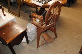 A spinning wheel with a bag of accessories