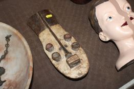 A carved African face mask