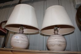 A pair of pottery table lamps and shades