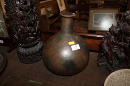 An African pottery bottleneck vase