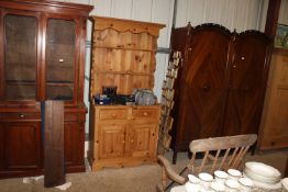 A modern pine dresser fitted two drawers raised on