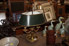 A brass twin branch table lamp and shade