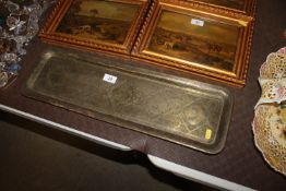 An Islamic brass engraved tray