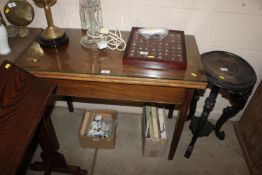 A 19th Century mahogany fold over supper table