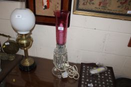 A modern glass table lamp in the form of a lustre